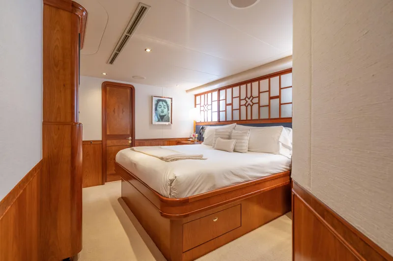 Avalina Yacht Photos Pics Luxurious bedroom interior on 2003 Westport yacht with elegant wood finishes and modern decor.