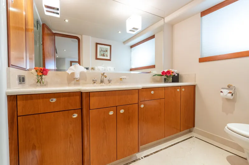 Avalina Yacht Photos Pics Luxurious bathroom with wooden cabinetry and elegant decor on a 2003 Westport yacht.