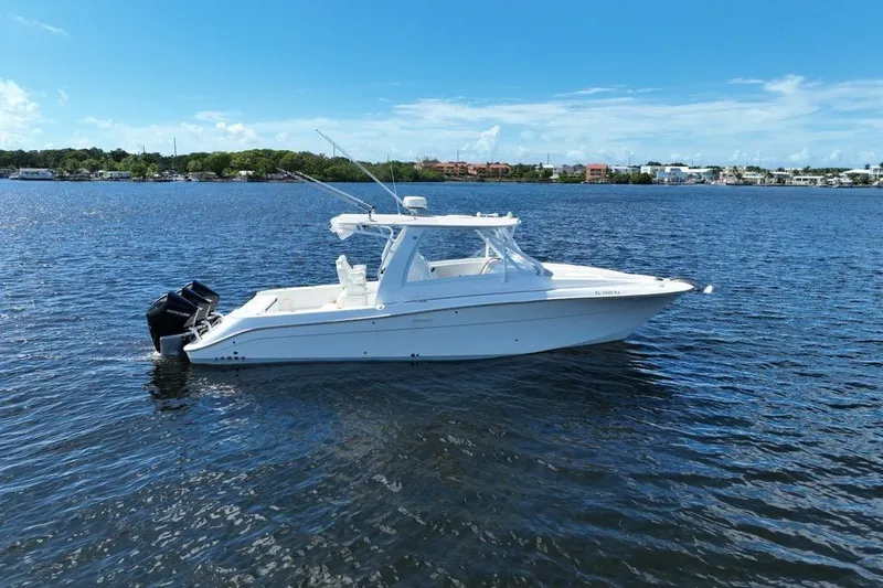  Yacht Photos Pics 2008 Hydra-Sports Vector 3500 VX boat on calm water under clear blue sky.