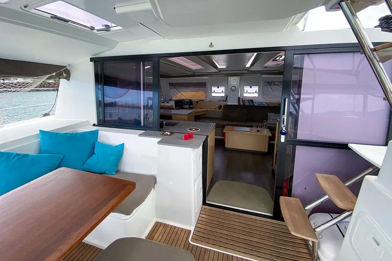  Yacht Photos Pics Interior of 2014 Fountaine Pajot Helia 44 catamaran with seating and dining area.