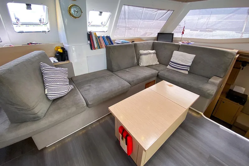  Yacht Photos Pics Luxurious interior of 2014 Fountaine Pajot Helia 44 catamaran with cozy seating and modern decor.
