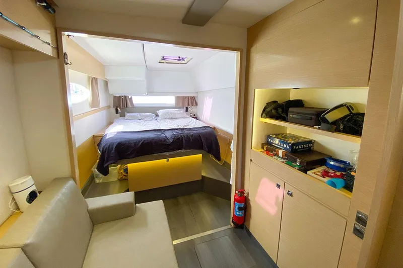  Yacht Photos Pics Interior of 2014 Fountaine Pajot Helia 44 catamaran with cozy bedroom and storage.