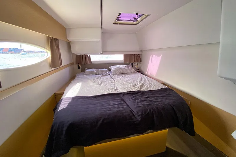  Yacht Photos Pics Luxurious cabin interior of 2014 Fountaine Pajot Helia 44 catamaran with cozy bedding.