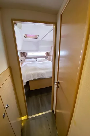  Yacht Photos Pics Cozy bedroom interior of 2014 Fountaine Pajot Helia 44 catamaran with double bed and skylight.