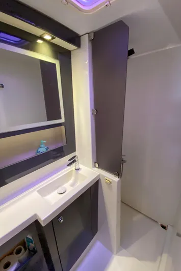  Yacht Photos Pics Modern bathroom interior of 2014 Fountaine Pajot Helia 44 catamaran with sleek fixtures.