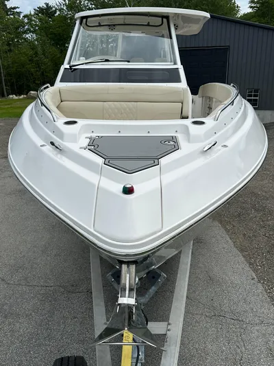  Yacht Photos Pics 2019 Regal 33 SAV boat on trailer, front view, white exterior, parked outdoors.