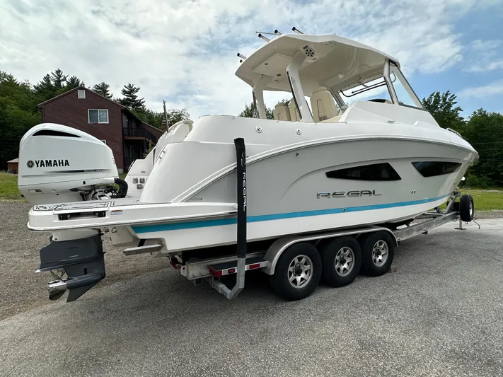  Yacht Photos Pics 2019 Regal 33 SAV boat on trailer with Yamaha outboard motor, parked outdoors.