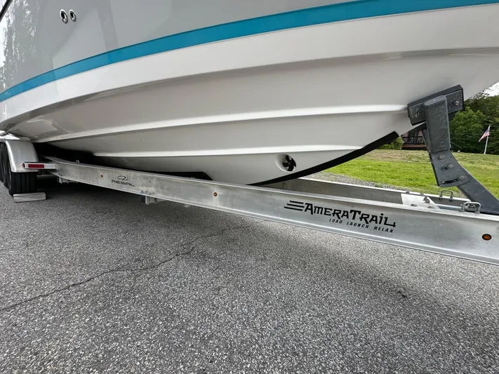  Yacht Photos Pics 2019 Regal 33 SAV boat on AmeraTrail trailer, parked on asphalt.