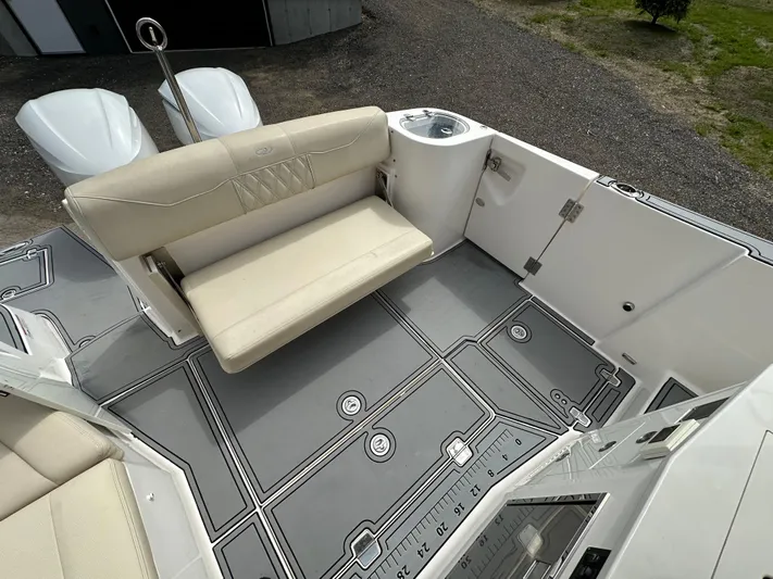  Yacht Photos Pics 2019 Regal 33 SAV boat interior with beige seating and gray flooring.