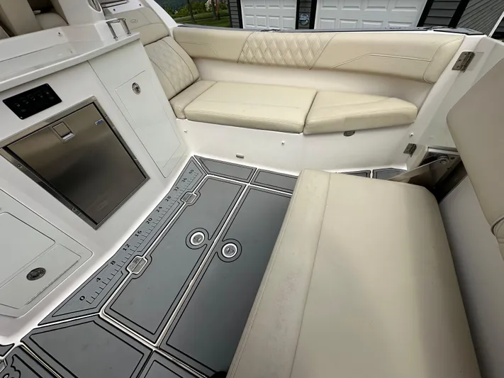  Yacht Photos Pics 2019 Regal 33 SAV boat interior with beige seating and modern flooring.