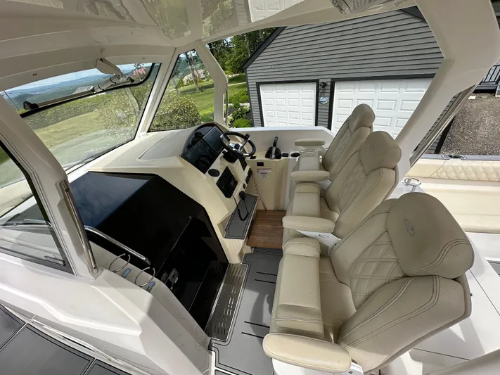  Yacht Photos Pics Interior of 2019 Regal 33 SAV boat with luxurious seating and modern dashboard.
