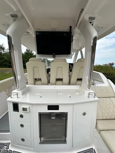  Yacht Photos Pics 2019 Regal 33 SAV boat interior with seating, storage, and mounted TV.