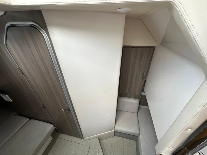  Yacht Photos Pics Interior cabin of 2019 Regal 33 SAV boat with modern design and wood accents.