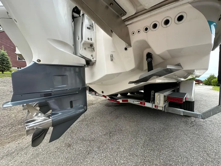  Yacht Photos Pics 2019 Regal 33 SAV boat on trailer, showing propeller and hull details.