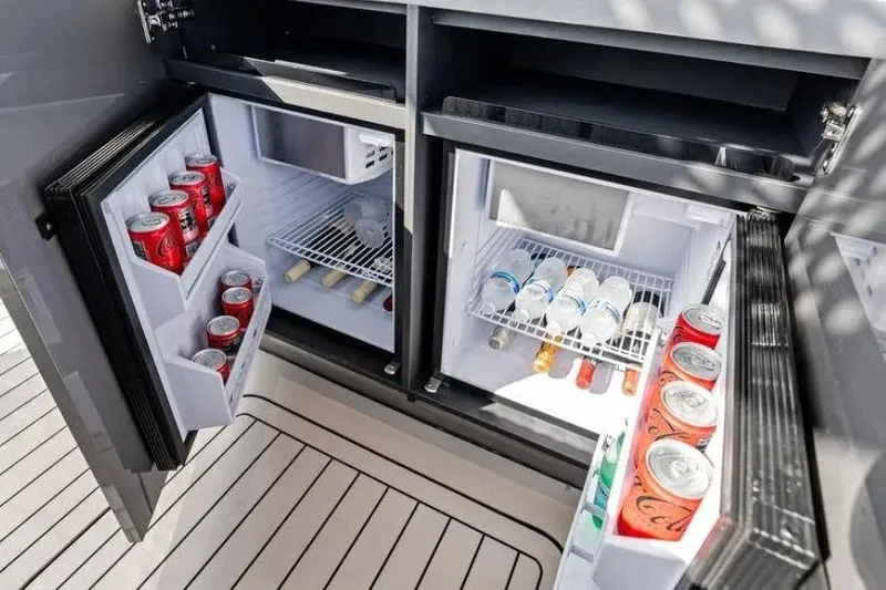 Chou Chou Yacht Photos Pics Dual mini fridges on Maori M 46 yacht, stocked with beverages, 2023 model.