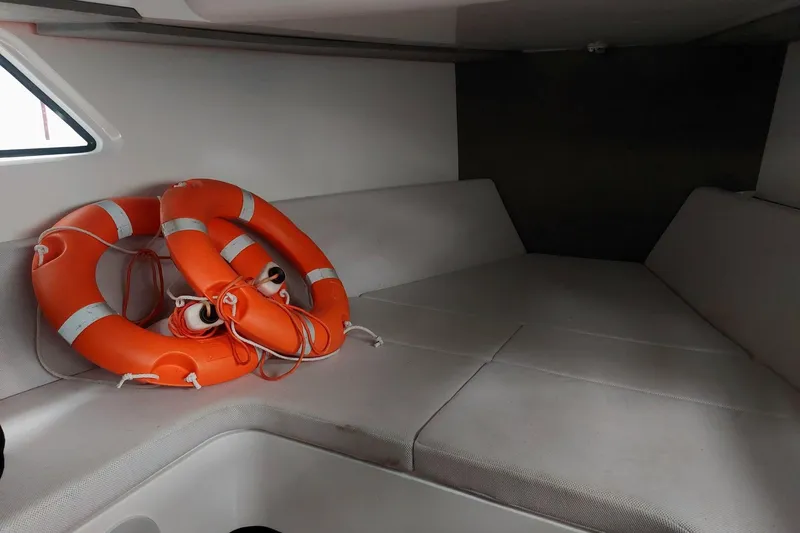 Chou Chou Yacht Photos Pics Interior of 2023 Maori M 46 boat with life rings on cushioned seating.