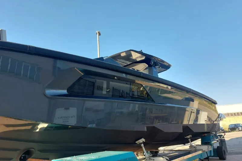 Chou Chou Yacht Photos Pics 2023 Maori M 46 yacht on trailer under clear blue sky.