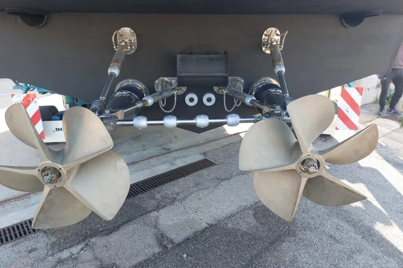 Chou Chou Yacht Photos Pics Dual propellers of a 2023 Maori M 46 boat on a concrete surface.