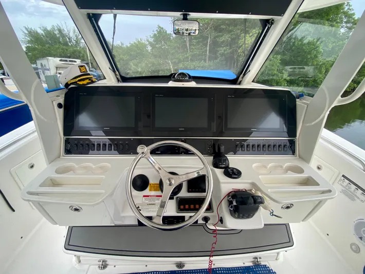 Wahooo Yacht Photos Pics 2016 Everglades 435 Center Console helm with advanced navigation displays and controls.