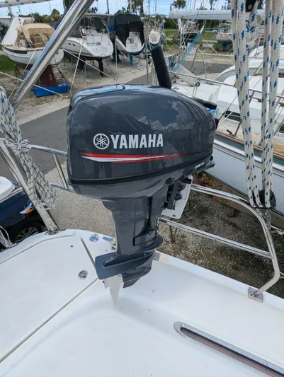 Momentum Yacht Photos Pics Yamaha outboard motor on 2007 Hunter 45 Center Cockpit sailboat, docked in marina.