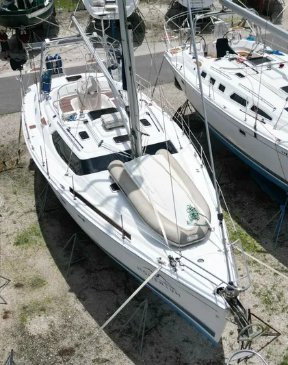 Momentum Yacht Photos Pics 2007 Hunter 45 Center Cockpit sailboat on land, viewed from above, with surrounding boats.