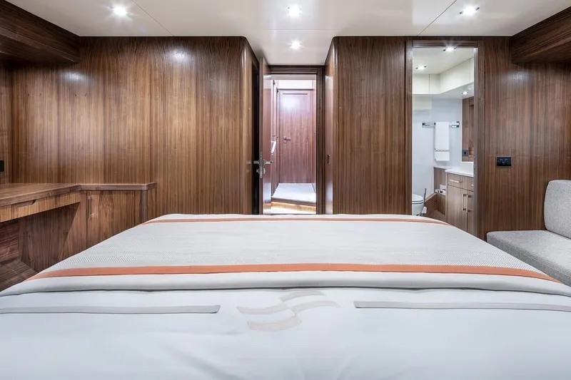  Yacht Photos Pics Luxurious 2021 Sirena 58 yacht cabin with wood paneling and modern amenities.
