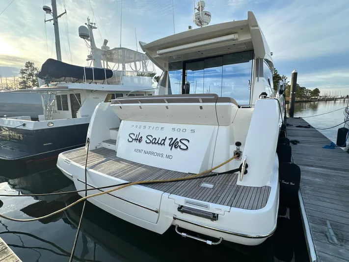 Yacht Photos Pics Prestige 500 S yacht docked, rear view, named "She Said Yes," 2015 model.