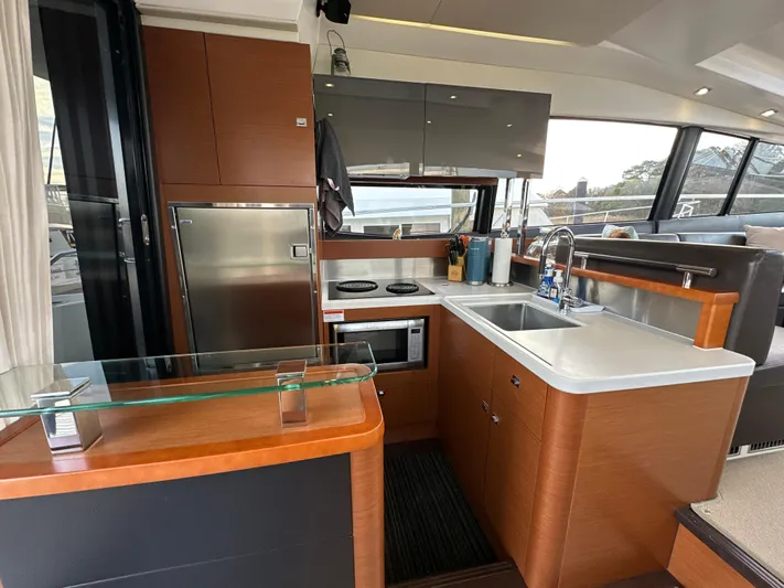  Yacht Photos Pics Modern kitchen interior of 2015 Prestige 500 S yacht with sleek design and appliances.