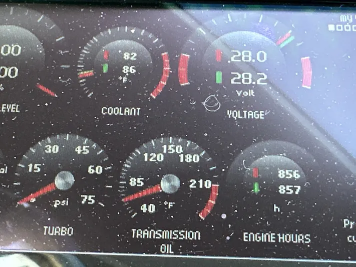  Yacht Photos Pics Dashboard gauges of a 2015 Prestige 500 S, showing coolant, voltage, turbo, and engine hours.