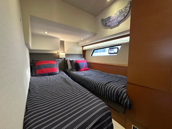  Yacht Photos Pics Twin cabin with striped bedding in 2015 Prestige 500 S yacht interior.