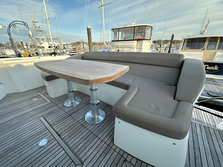  Yacht Photos Pics Prestige 500 S 2015 yacht deck with seating and table, docked at marina.