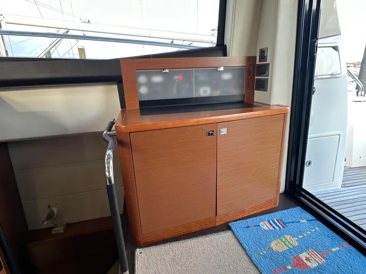  Yacht Photos Pics Interior of 2015 Prestige 500 S yacht with wooden cabinet and colorful mat.