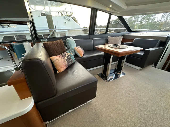  Yacht Photos Pics Luxurious interior of a 2015 Prestige 500 S yacht with elegant seating and table.