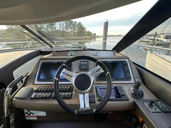  Yacht Photos Pics Prestige 500 S 2015 yacht helm with modern navigation controls and steering wheel.