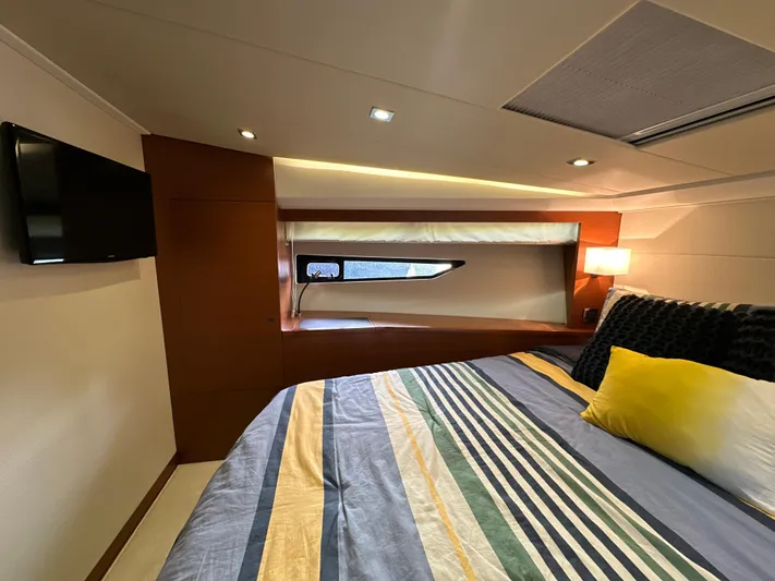  Yacht Photos Pics Luxurious cabin interior of 2015 Prestige 500 S yacht with modern bedding and ambient lighting.