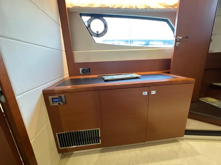  Yacht Photos Pics Interior of 2015 Prestige 500 S yacht with wooden cabinetry and window.