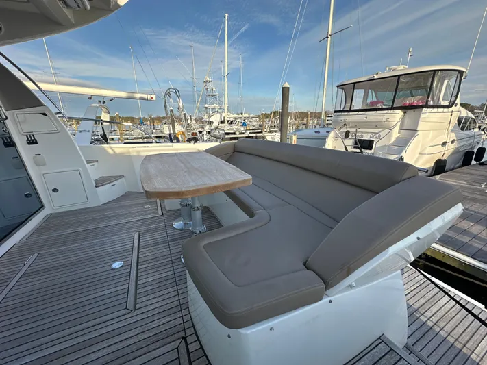  Yacht Photos Pics Prestige 500 S 2015 yacht deck with seating and table, docked at marina.