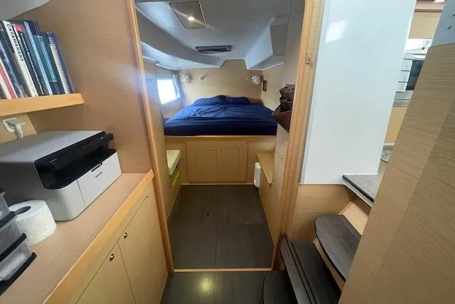 Buzio Yacht Photos Pics Interior of 2014 Lagoon 380 S2 yacht with cozy bedroom and modern amenities.