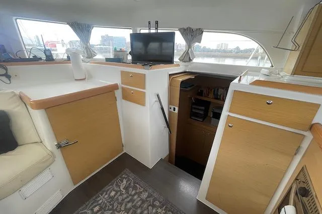 Buzio Yacht Photos Pics Interior of 2014 Lagoon 380 S2 catamaran with modern furnishings and a cozy living space.