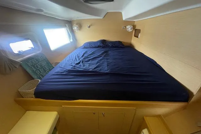 Buzio Yacht Photos Pics Cabin interior of 2014 Lagoon 380 S2 with cozy bed and natural light.