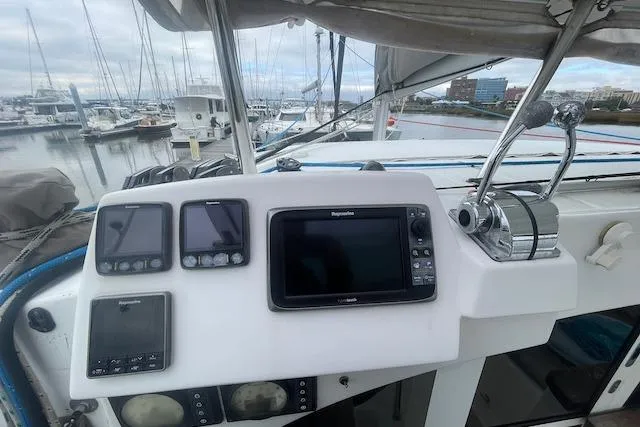 Buzio Yacht Photos Pics Control panel of a 2014 Lagoon 380 S2 catamaran docked at a marina.