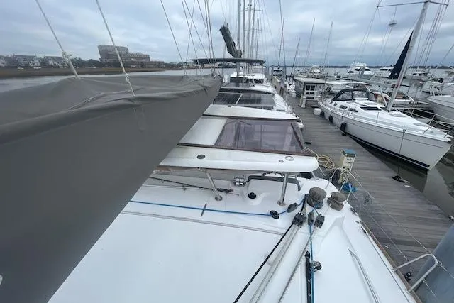 Buzio Yacht Photos Pics Lagoon 380 S2 catamaran docked at marina, 2014 model, overcast sky.
