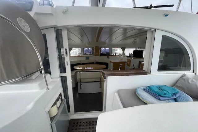 Buzio Yacht Photos Pics Interior view of 2014 Lagoon 380 S2 catamaran, featuring spacious seating and modern amenities.