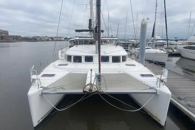 Buzio Yacht Photos Pics 2014 Lagoon 380 S2 catamaran docked at a marina, front view.