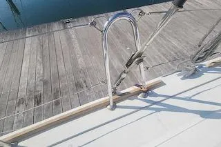 Buzio Yacht Photos Pics Deck view of 2014 Lagoon 380 S2 yacht with dock in background.