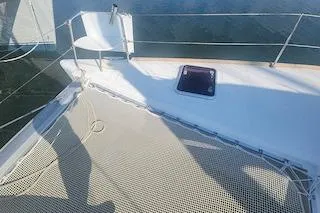 Buzio Yacht Photos Pics 2014 Lagoon 380 S2 catamaran deck with netting and seating area.