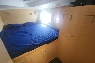 Buzio Yacht Photos Pics 2014 Lagoon 380 S2 cabin with blue bedding and natural light.