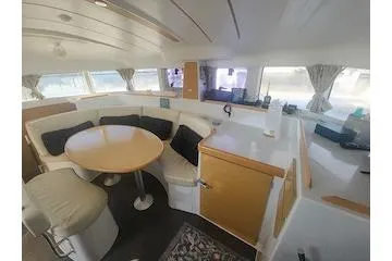 Buzio Yacht Photos Pics Interior of 2014 Lagoon 380 S2 catamaran with cozy seating and dining area.