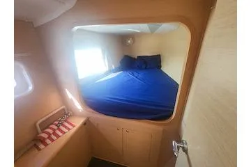 Buzio Yacht Photos Pics 2014 Lagoon 380 S2 cabin interior with bed and window.