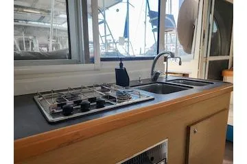 Buzio Yacht Photos Pics 2014 Lagoon 380 S2 yacht kitchen with stove and sink, featuring modern design.